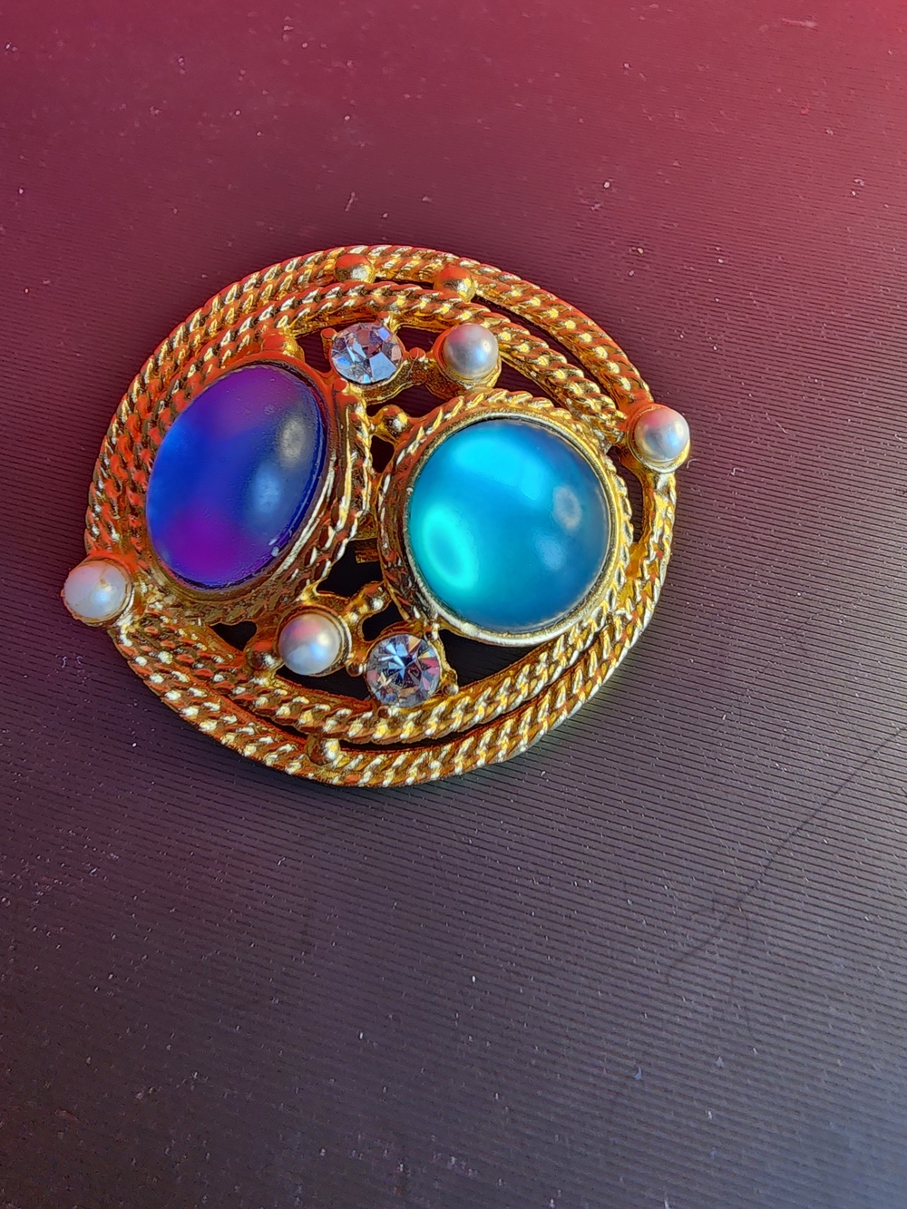 Gold-Tone Brooch with Iridescent Blue and Purple Cabochons
